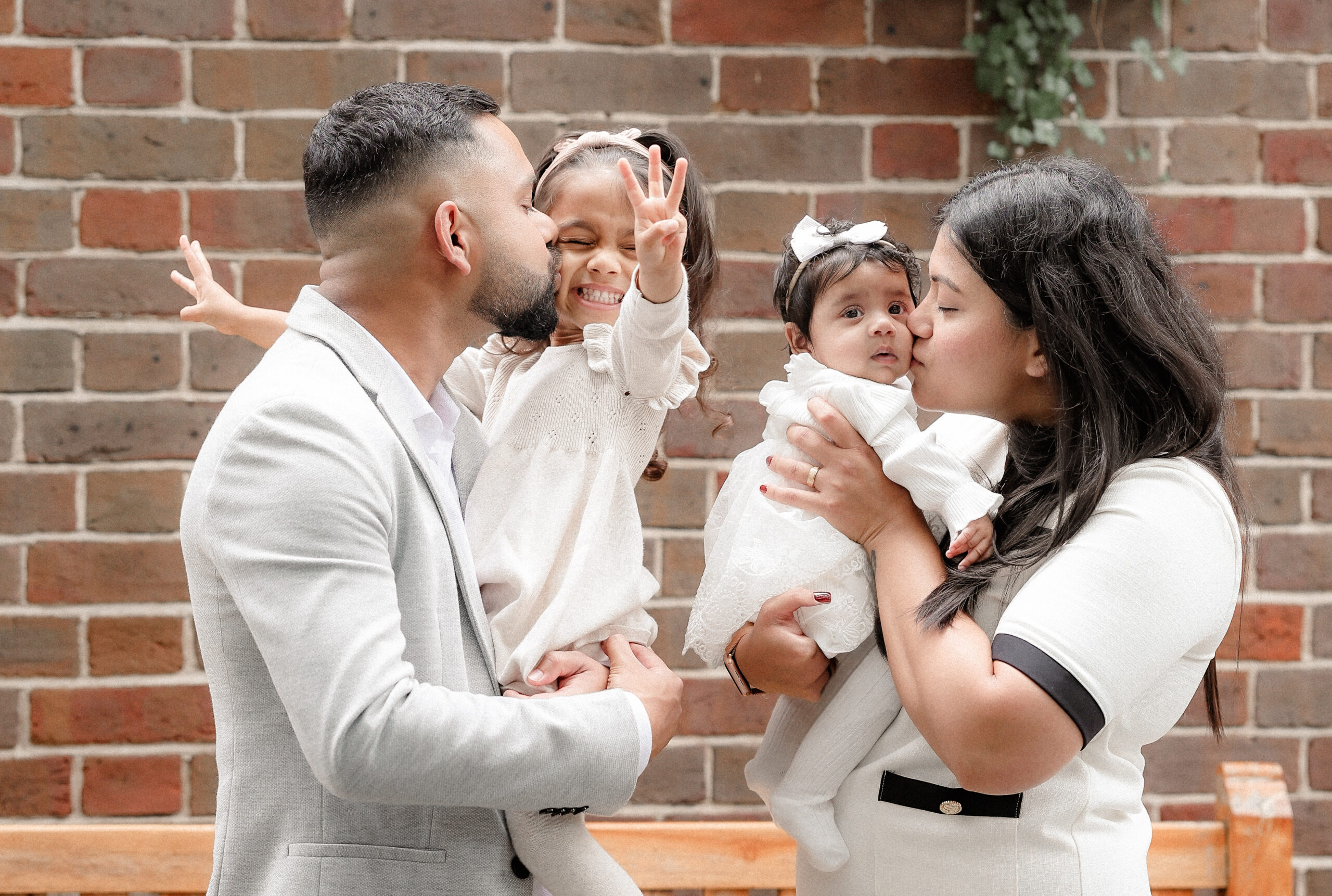 Parents holding toddler during family photoshoot
