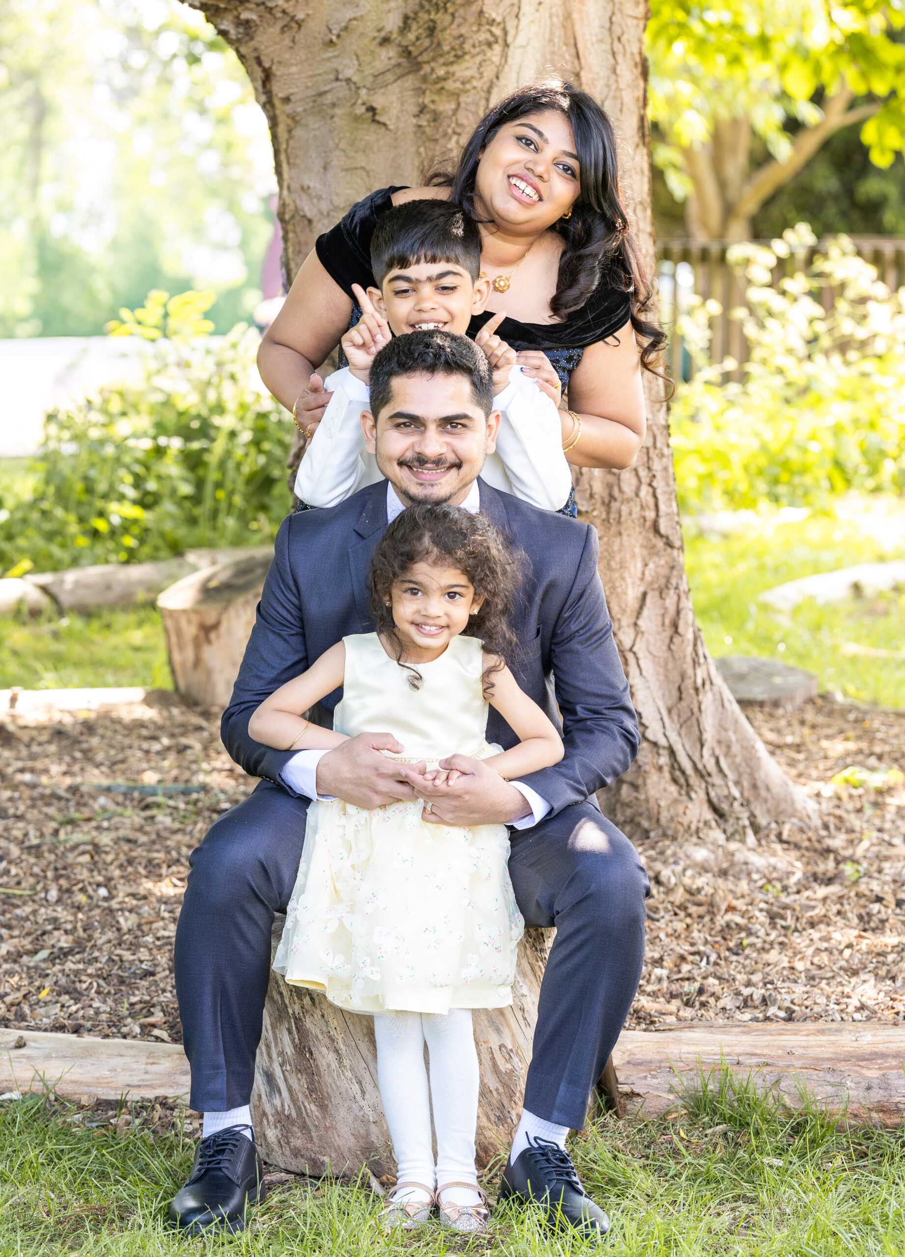 Family playing together during outdoor photoshoot