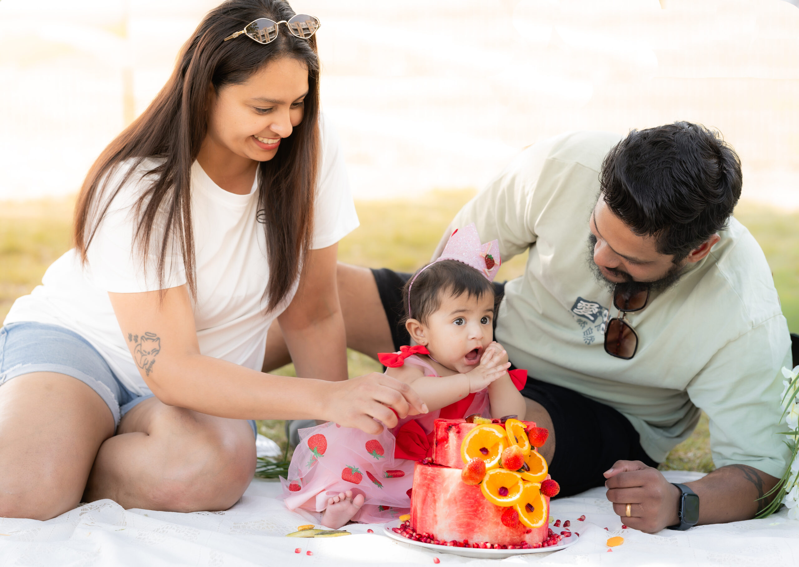 A family laughing together during a Little Grins photography session in Surrey