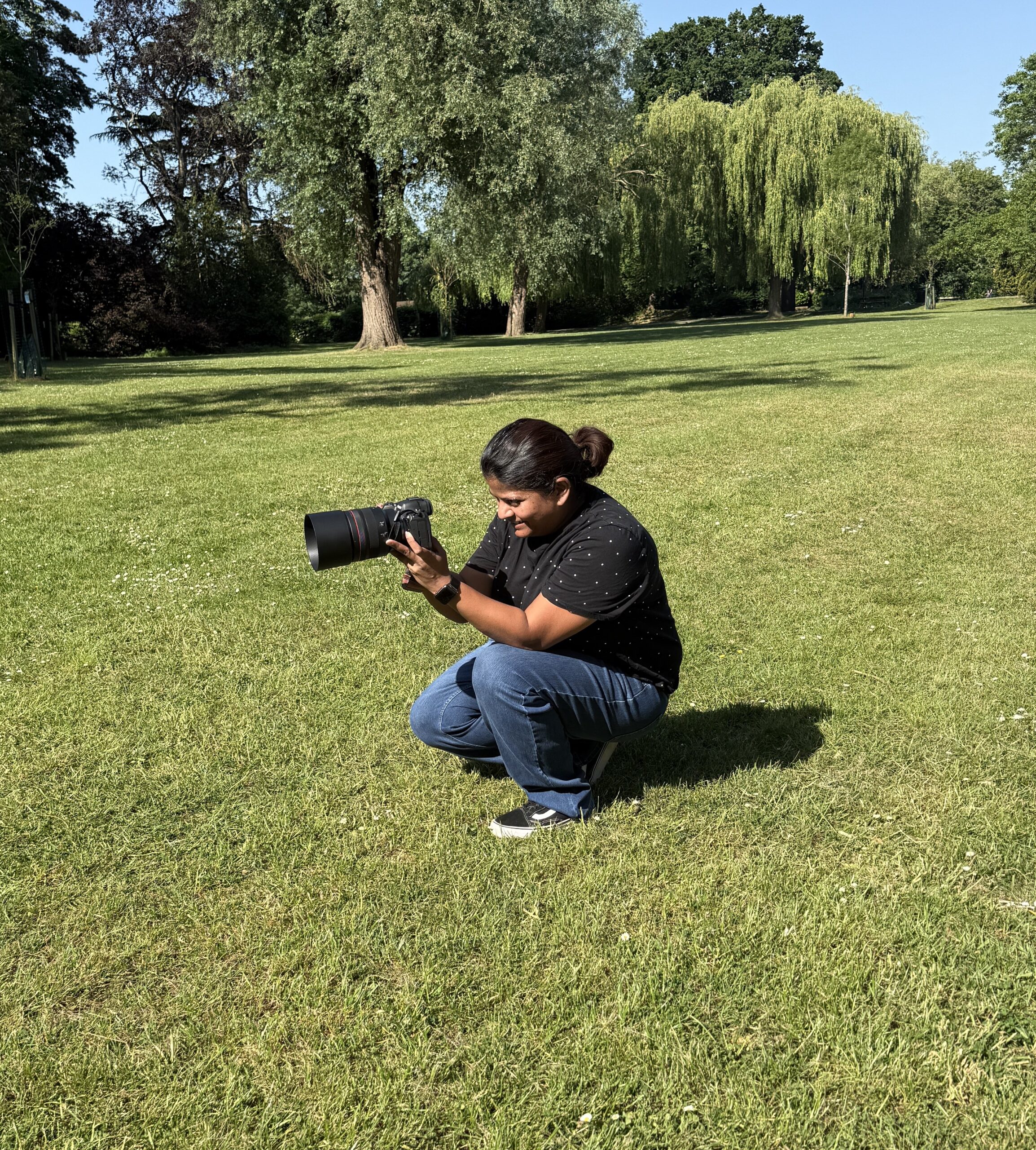 Sue, photographer at Little Grins Photography, smiling during a family session in Surrey